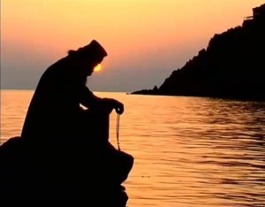 Monk Praying in Sunset