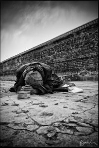 beggar at a wall
